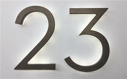 Modern neutra 8" bronze backlit numbers by Luxello LED Signage