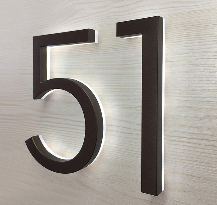Modern neutra 8" bronze backlit numbers by Luxello LED Signage