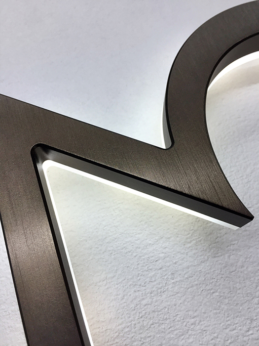 Modern neutra 8" bronze backlit numbers by Luxello LED Signage