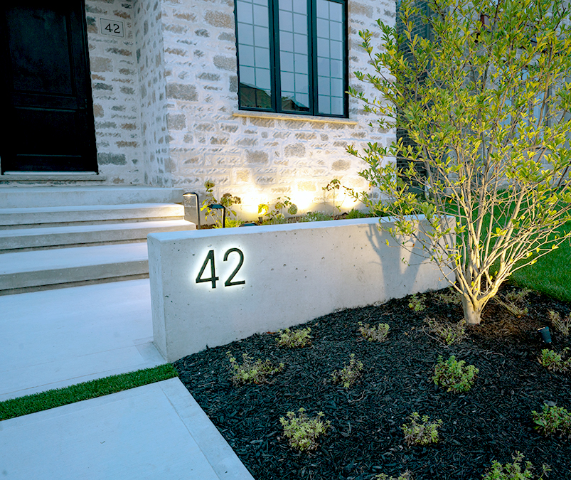 Modern neutra 8" bronze backlit numbers by Luxello LED Signage